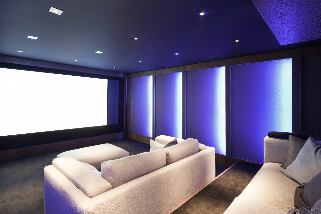 Cozy home theater with couch and projector screen featured in Complete Guide to Home Theatre Lighting - Essential Home Theater Lighting Tips for an Immersive Experience - Vorlane - Vorlane Cozy home theater with couch and projector screen featured in Complete Guide to Home Theatre Lighting - Essential Home Theater Lighting Tips for an Immersive Experience - Vorlane - Vorlane