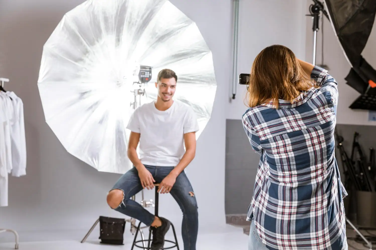 Front Lighting Photography Image of a man and woman getting photographed in a studio - Front Lighting Photography: How to Shoot With Front Light - Vorlane - Vorlane Front Lighting Photography Image of a man and woman getting photographed in a studio - Front Lighting Photography: How to Shoot With Front Light - Vorlane - Vorlane