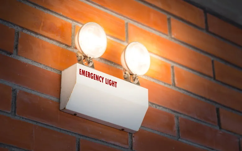 Illuminated brick wall with two lights white light glowing Picture included in A Guide to Emergency Lighting - A Guide to Emergency Lighting - Vorlane - Vorlane Illuminated brick wall with two lights white light glowing Picture included in A Guide to Emergency Lighting - A Guide to Emergency Lighting - Vorlane - Vorlane