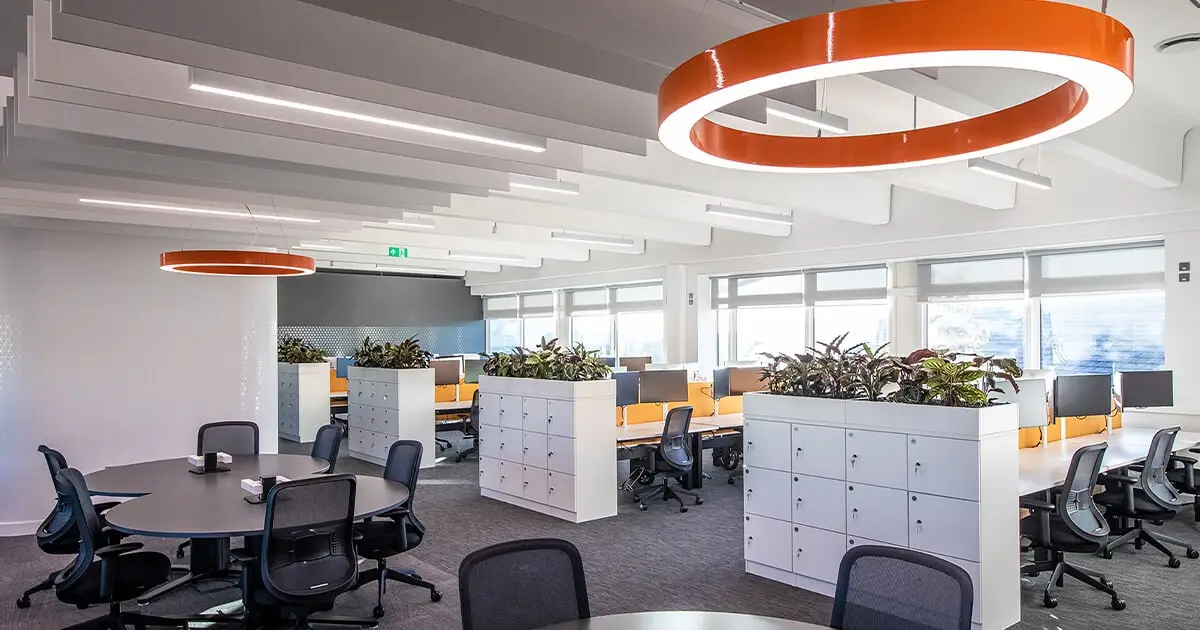 Office with orange lighting and black chairs meeting UK Workplace Lighting Regulations - Workplace Lighting Regulations in the UK: Ensuring Safety and Productivity - Vorlane - Vorlane Office with orange lighting and black chairs meeting UK Workplace Lighting Regulations - Workplace Lighting Regulations in the UK: Ensuring Safety and Productivity - Vorlane - Vorlane